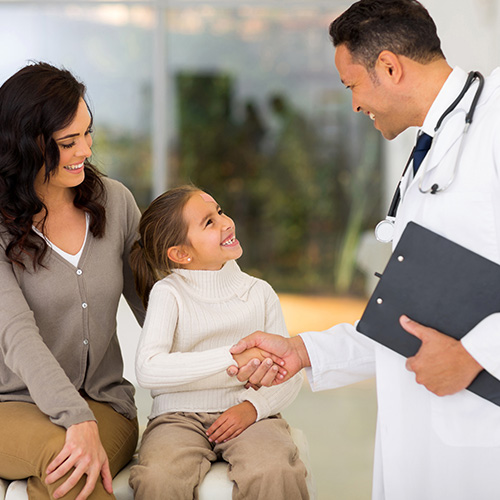 woman and daughter meeting in person with doctor