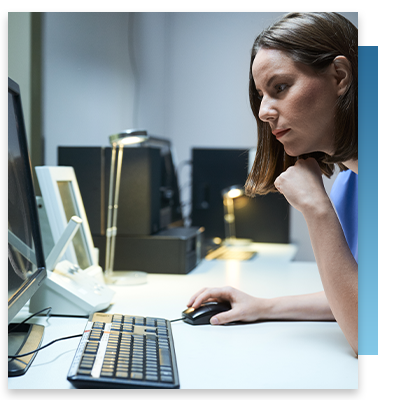 Image of a nurse looking at a computer