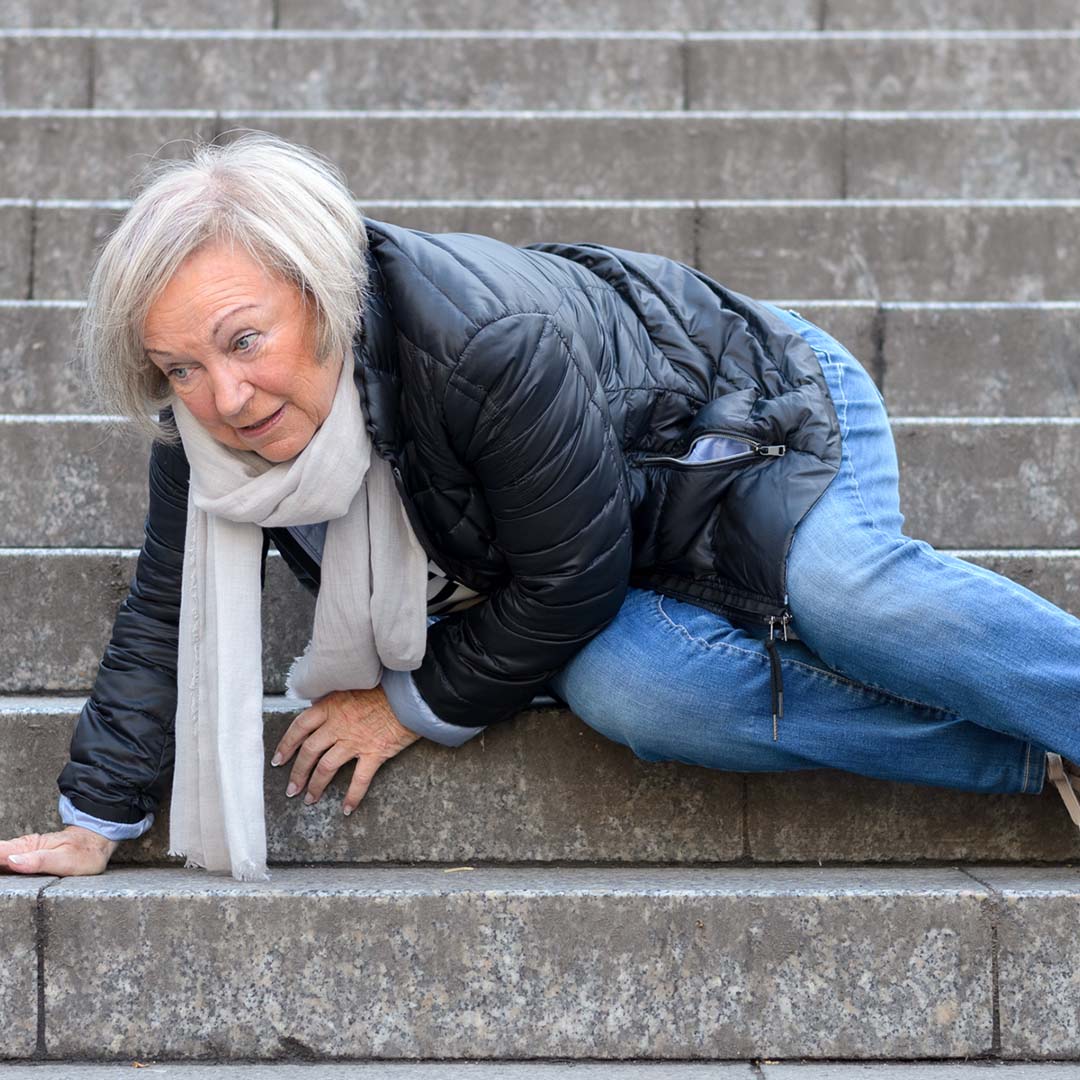 woman falling on outdoor stairs