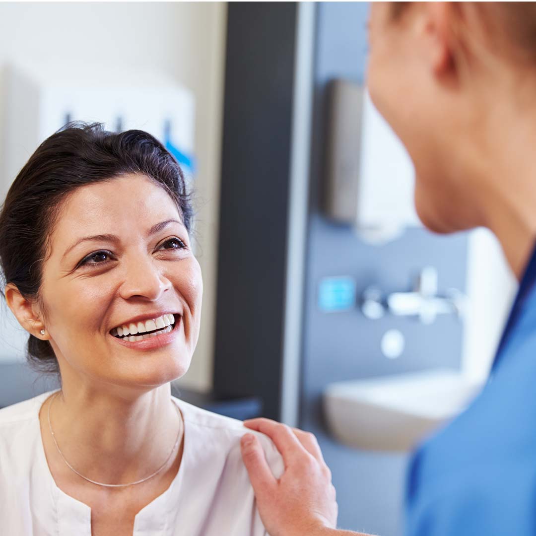 Doctor with hand on patient's shoulder