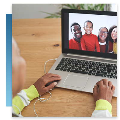 A elderly woman on a video call with her family