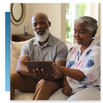 Two seniors looking at a tablet together