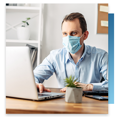 A CIO working at his desk on his laptop
