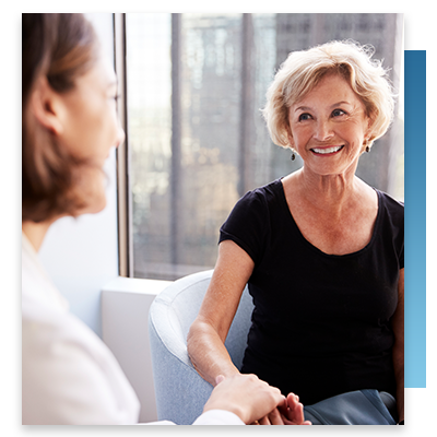 A happy patient talking with a healthcare provider