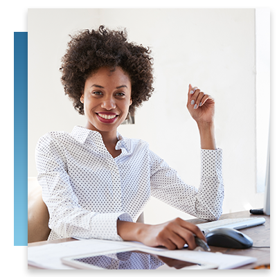 A CIO smiling at her computer