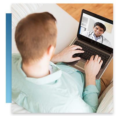 A young man chatting with a doctor on a video call while sitting on his couch