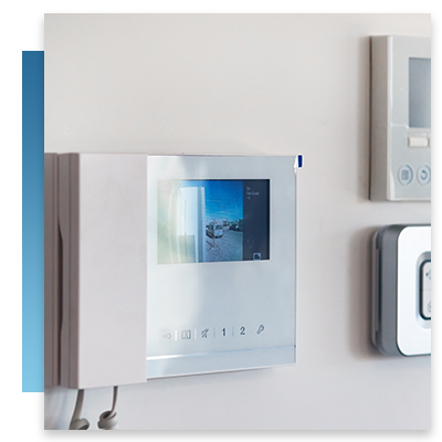 An intercom system beside a security alarm