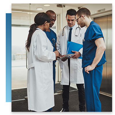 A doctor and group of nurses train on their new technology