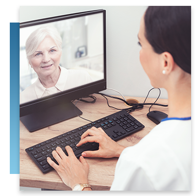 A healthcare provider on a video call with an elderly patient