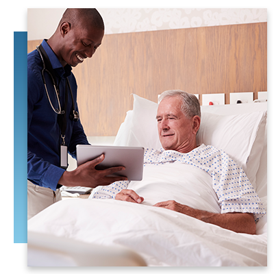 A doctor speaking with a patient while holding out a tablet