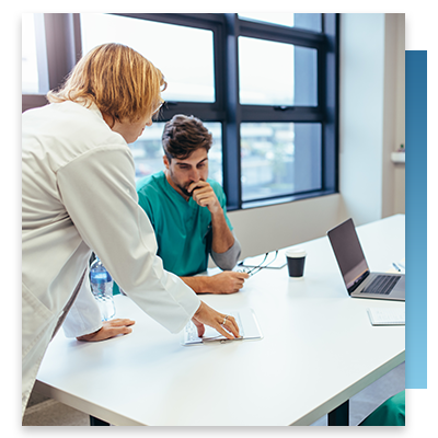 A doctor and nurse in a meeting room