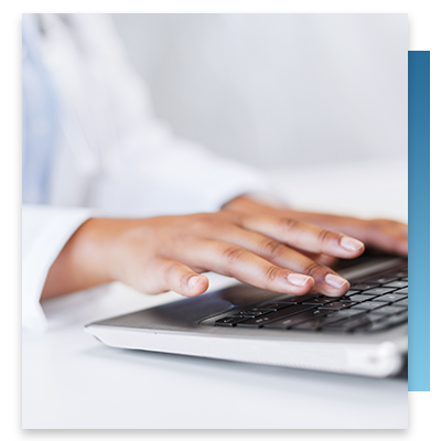 A doctor typing on her keyboard