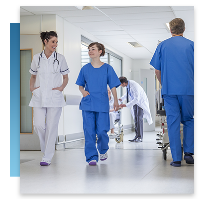 Nurses and doctors walking through a hospital hallway