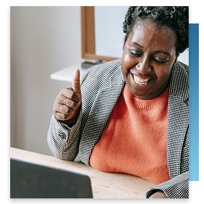 A happy woman video chatting with family