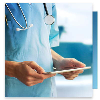 A nurse's hands holding a tablet