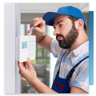 A technician installing a nurse call system at a hospital