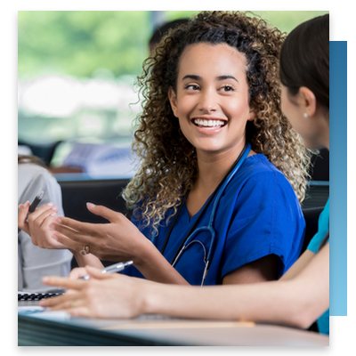 Two nurses talking while taking a continuing education course