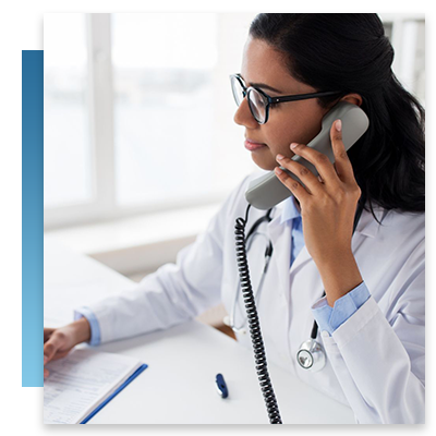 A doctor at her desk on the phone