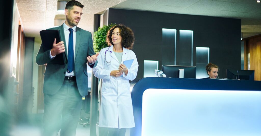 A businessman and doctor walking and talking