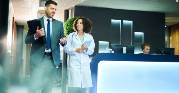 A businessman and doctor walking and talking