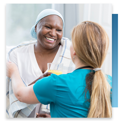A nurse talking to a smiling patient