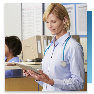 A doctor looking at a tablet