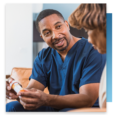 A nurse helping a patient with their medication