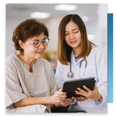 A doctor showing a patient a tablet
