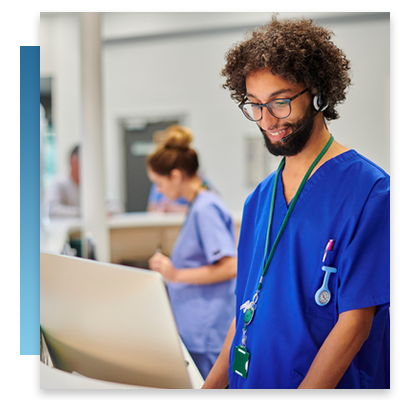 A nurse at a desk using a call system