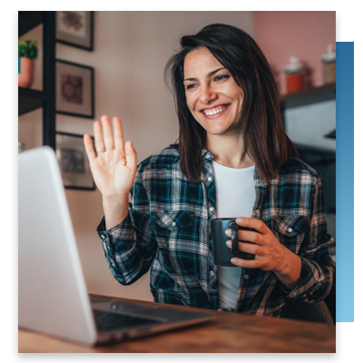 A woman in her kitchen on a video call