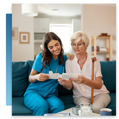 A nurse sitting and talking with a patient while they look at photographs