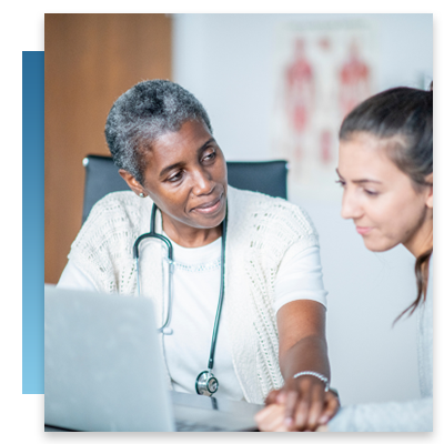 A doctor and patient looking at a computer while talking