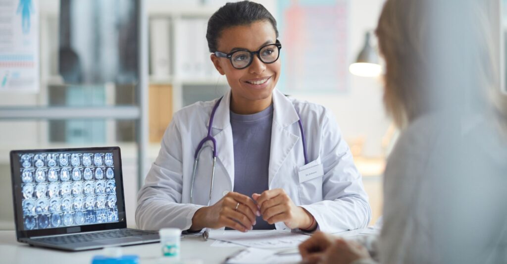 A doctor listening to a patient