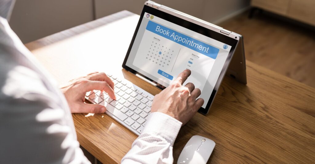 A person scheduling an appointment on a tablet