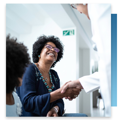 A doctor greeting a patient in a waiting room