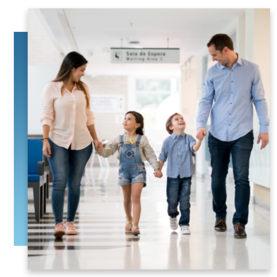 A family walking through a hospital hallway