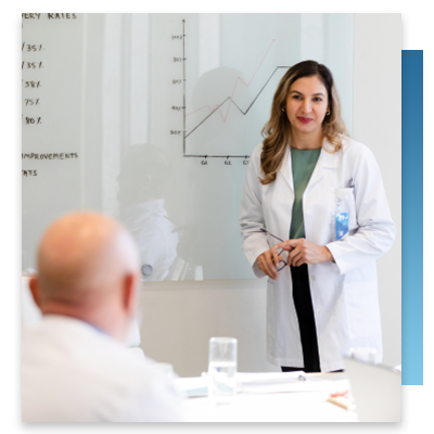 A doctor in a financial meeting with hospital administration