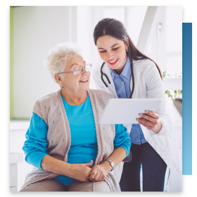 A doctor and patient looking at a tablet together