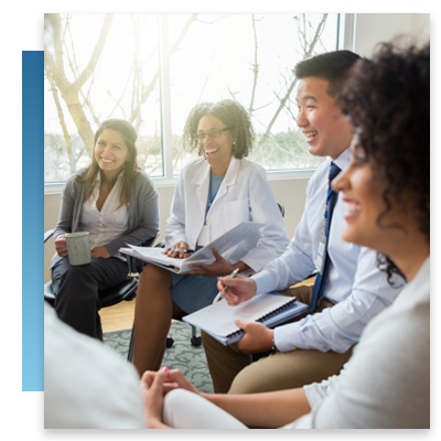 Doctors laughing during a meeting
