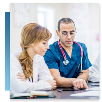 A nurse and doctor looking at paperwork