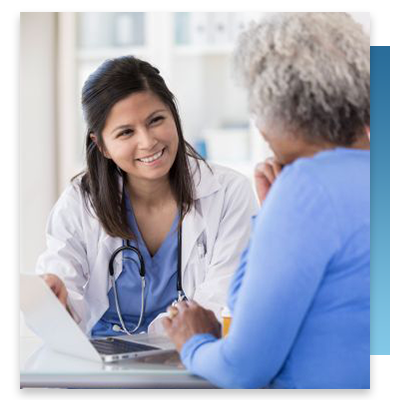 A patient and doctor talking at the doctor's desk
