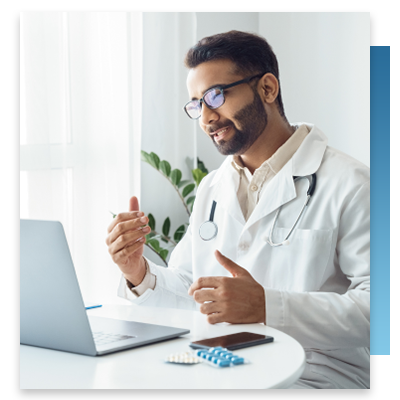 A doctor using his laptop during a telehealth call