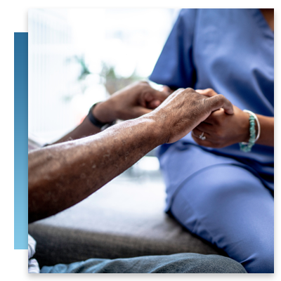 A nurse holding a patient's hands