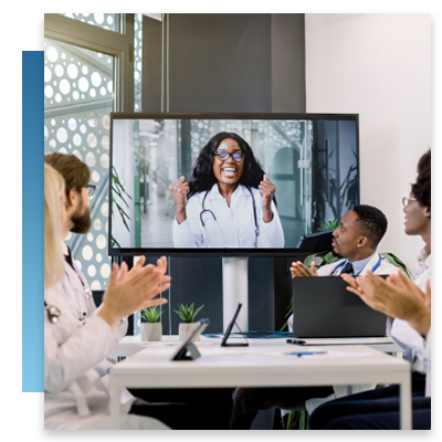 A doctor joining colleagues in a meeting digitally