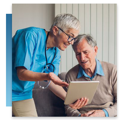 A nurse showing a nursing home resident a tablet