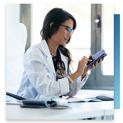 A doctor receiving an alarm on her phone