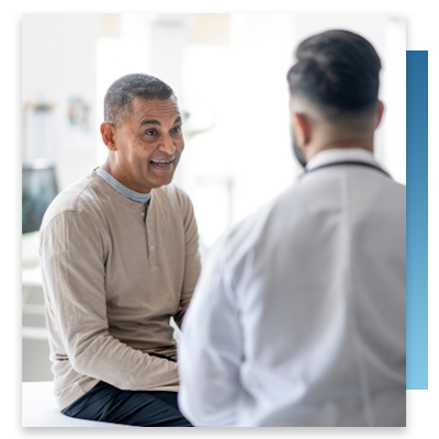 A content patient speaking with his doctor