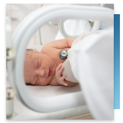 A newborn in a hospital crib