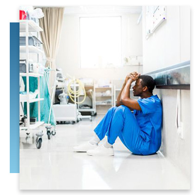 Stressed out nurse sitting on the floor