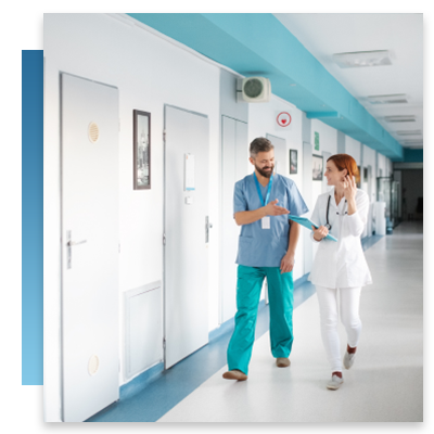 A nurse and doctor walking down a hallway